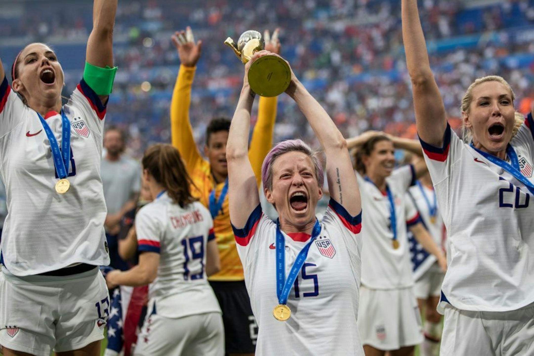 Megan Rapinoe of the USA celebrates with the FIFA Women's World Cup Trophy following her team's victory in the 2019 FIFA Women's World Cup France Final match between The United States of America and The Netherlands at Stade de Lyon on July 7, 2019 in Lyon, France.