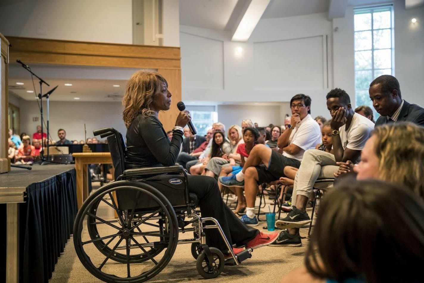 School President Donna Harris speaks during a prayer service at the Minnehaha Academy Lower School Wednesday, Aug. 2, 2017, in Minneapolis, Minn. Firefighters were searching for a man believed to be buried in the rubble of the collapsed school building in Minneapolis on Wednesday after an explosion killed another school employee and injured several others.