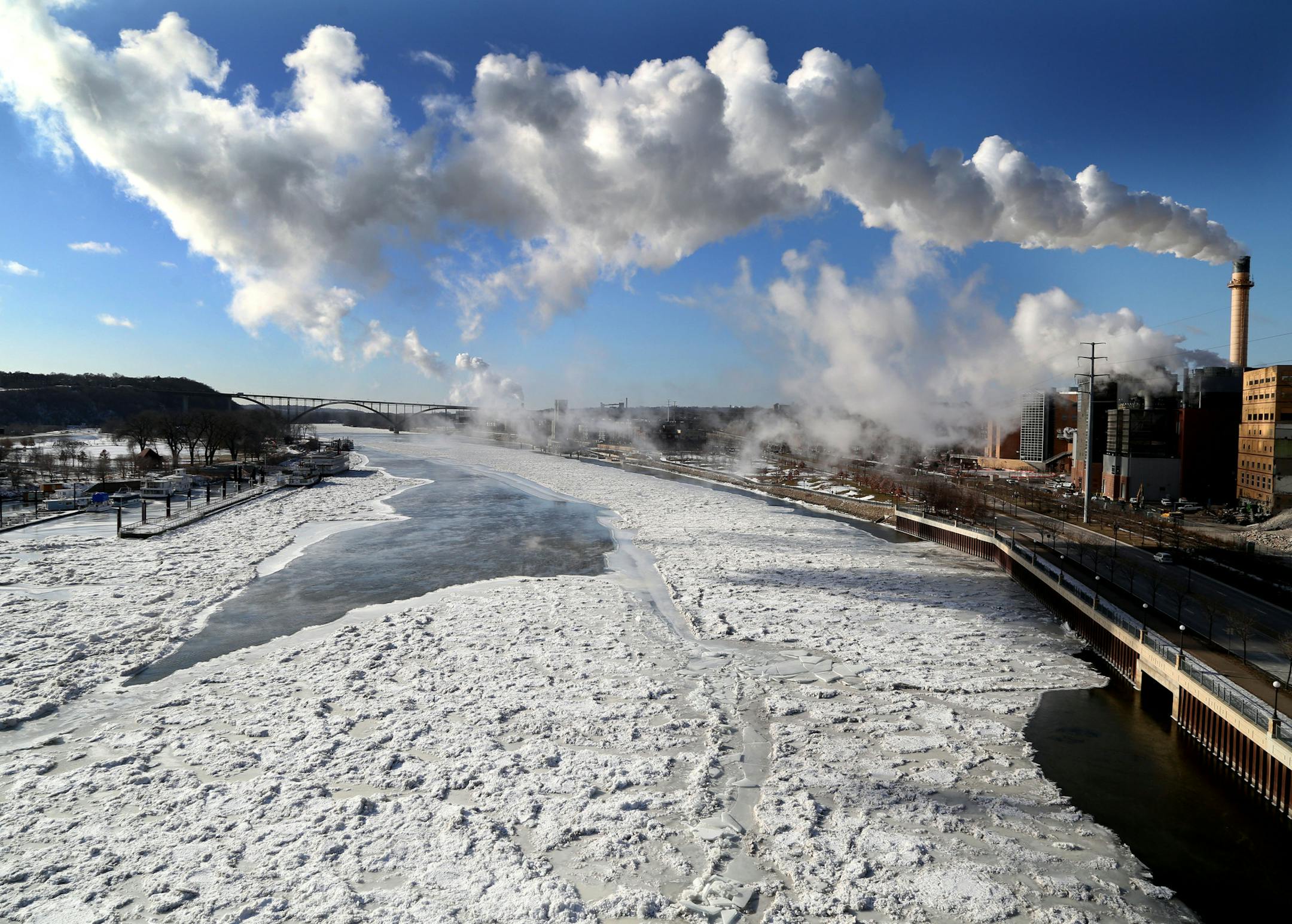 Seen from the Wabasha Street Bridge, most of the Mississippi River is frozen below as arctic air settles in Wednesday, Jan. 4, 2016, in St. Paul, MN.](DAVID JOLES STARTRIBUNE)djoles@startribune.com A commuter sits on a metro bus during frigid morning weather at the Chicago Lake Transit Center Wednesday, Jan. 4, 2016, in Minneapolis, MN.
