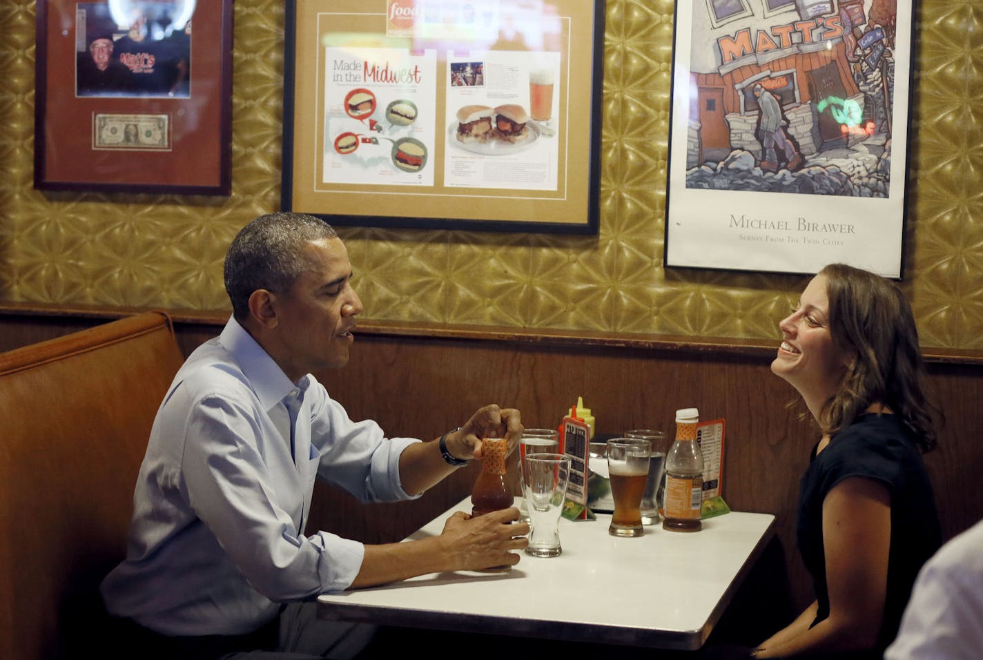 President Barack Obama talked with Rebekah Erler, 36, of Minneapolis at Matts Bar before going to a town hall meeting at Minnehaha Park on June 26, 2014.