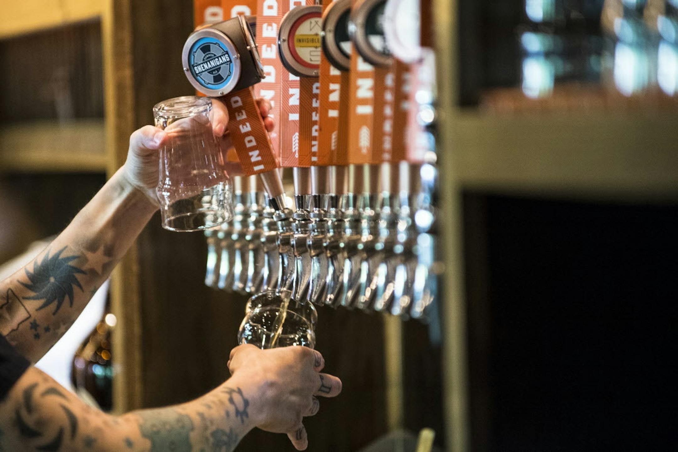 Heather Kraft poured beer for customers Wednesday afternoon. ] (AARON LAVINSKY/STAR TRIBUNE) aaron.lavinsky@startribune.com As the craft beer market continues to grow in Minnesota and nationwide, analysts and insiders wonder if it's a Renaissance or a bubble. For now, brewers and customers are showing no signs of a slowdown. We photograph day-to-day operations at Indeed Brewery and the bar at New Bohemia on Wednesday, May 25, 2016 in Minneapolis.