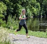 Alisha Perkins, shown running near downtown Minneapolis, credits running with helping her find a balance in her life.