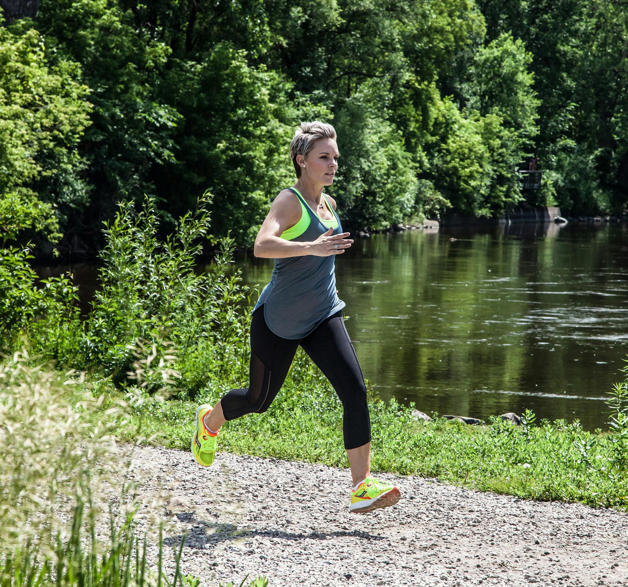 Alisha Perkins, shown running near downtown Minneapolis, credits running with helping her find a balance in her life.