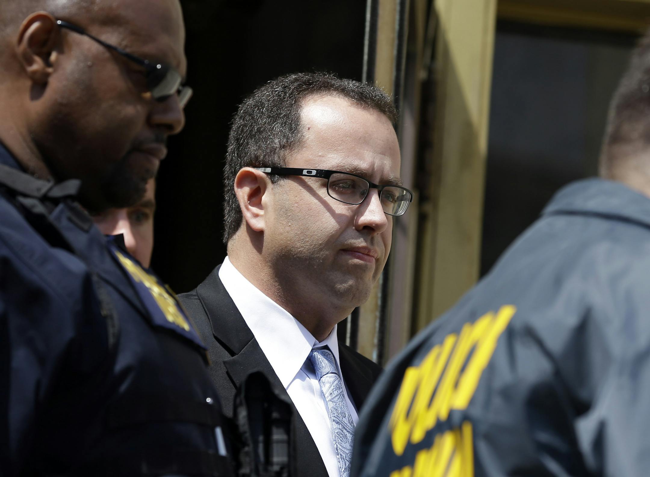 FILE - In this Aug. 19, 2015, file photo, former Subway pitchman Jared Fogle leaves the federal courthouse in Indianapolis, following a hearing on child-pornography charges. Fogle is scheduled Thursday, Nov. 19, 2015, to face a federal judge in Indianapolis for sentencing, after agreeing in August to plead guilty to charges of illicit sexual conduct with a minor and receiving child pornography. (AP Photo/Michael Conroy, File)