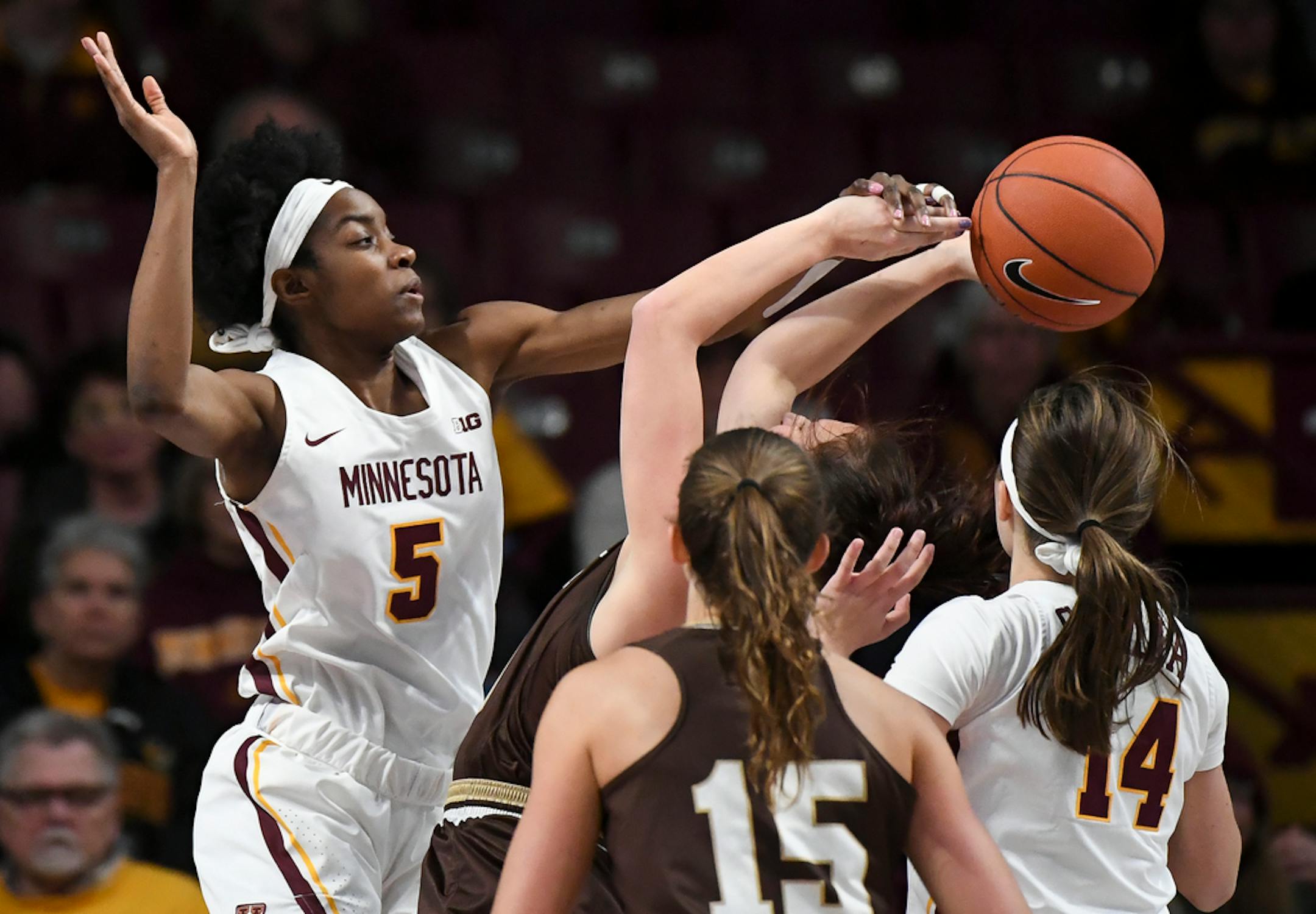 Minnesota Gophers forward Taiye Bello (5) blocked a shot by Lehigh Mountain Hawks guard Megan Walker (10) in the first half.