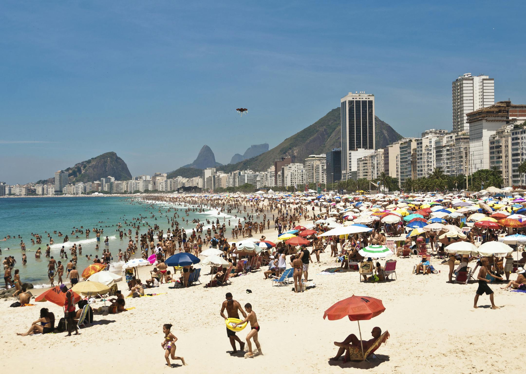 Rio de Janeiro, Brazil - December 28, 2014: Thousands of brazilians enjoy hot and sunny weekend in Copacabana beach. iStock