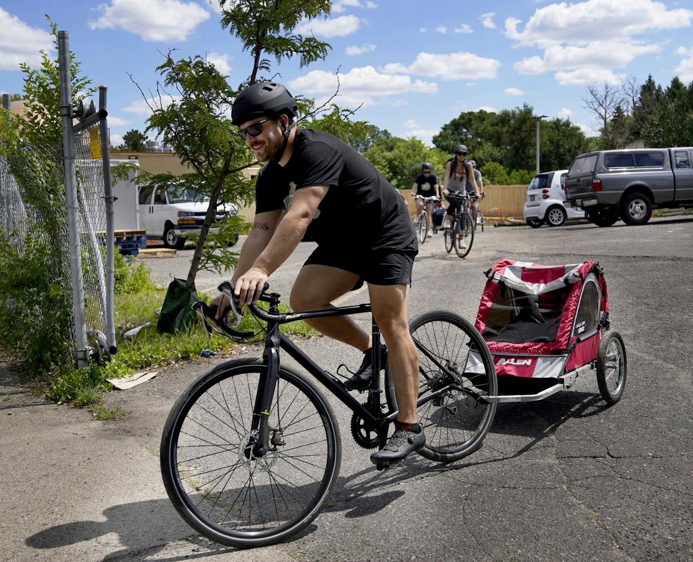 Brian Boyer, front, and members of his Bikes & Bites squad pedaled away from Al-Maa'Uun after dropping off a large supply of food, diapers and other essentials Friday in Minneapolis. Al-Maa'Uun delivers food and supplies to those in need in North Minneapolis.] DAVID JOLES • david.joles@startribune.com During the nights of unrest following the murder of George Floyd, Brian Boyer hopped on his bike to bring supplies to those in need. His southwest Minneapolis neighborhood pitched in, and the bike