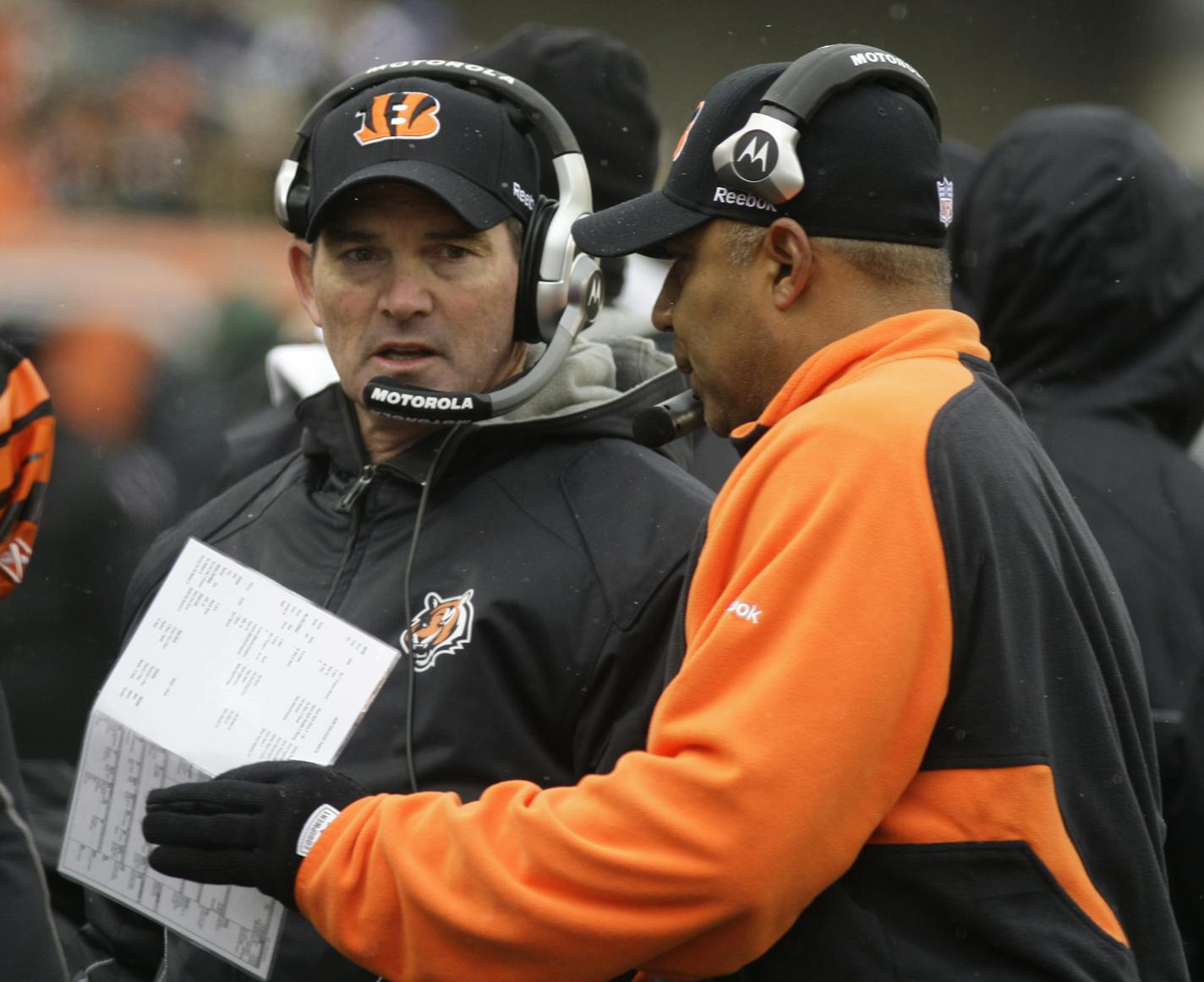 Cincinnati Bengals defensive coordinator Mike Zimmer, left, talks with Cincinnati Bengals head coach Marvin Lewis in the first half of an NFL football game against the New Orleans Saints, Sunday, Dec. 5, 2010, in Cincinnati. (AP Photo/David Kohl) ORG XMIT: NYOTK