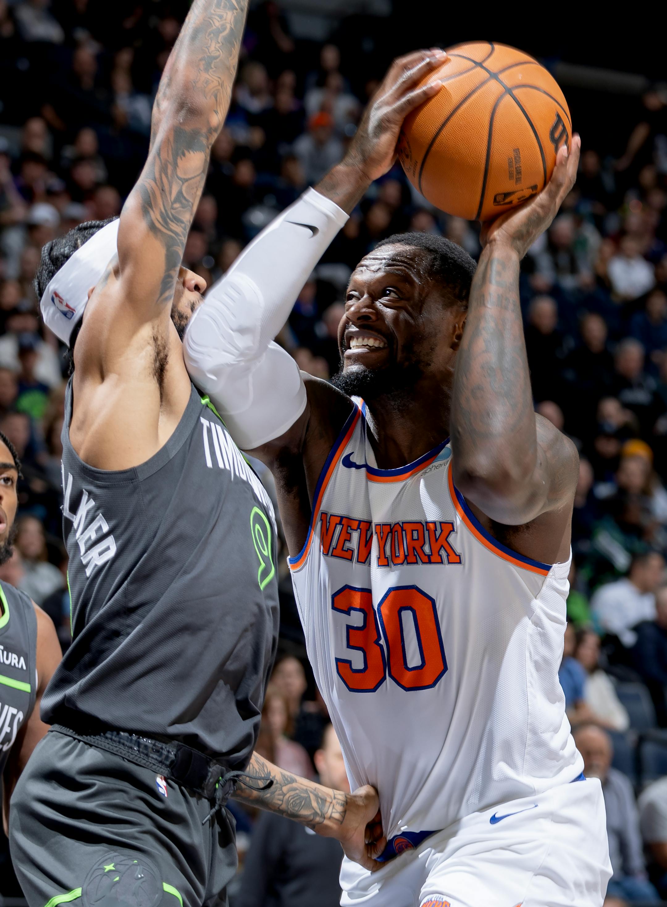 Nickeil Alexander-Walker (9) of the Minnesota Timberwolves defends Julius Randle (30) of the New York Knicks in the second quarter Monday, November 20, 2023, at Target Center in Minneapolis, Minn. ] CARLOS GONZALEZ • carlos.gonzalez@startribune.com