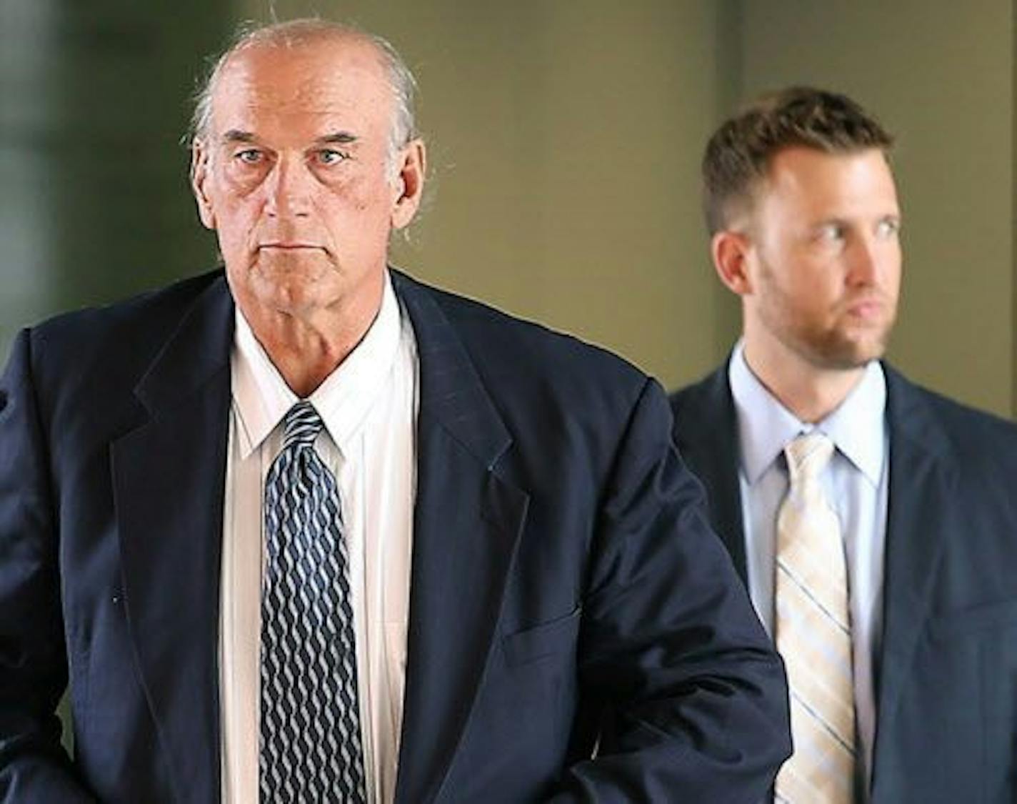 Former Gov. Jesse Ventura made his way out of the Warren E. Burger Federal Building during the first day of jury selection in his defamation trial, Tuesday, July 8, 2014, in St. Paul.