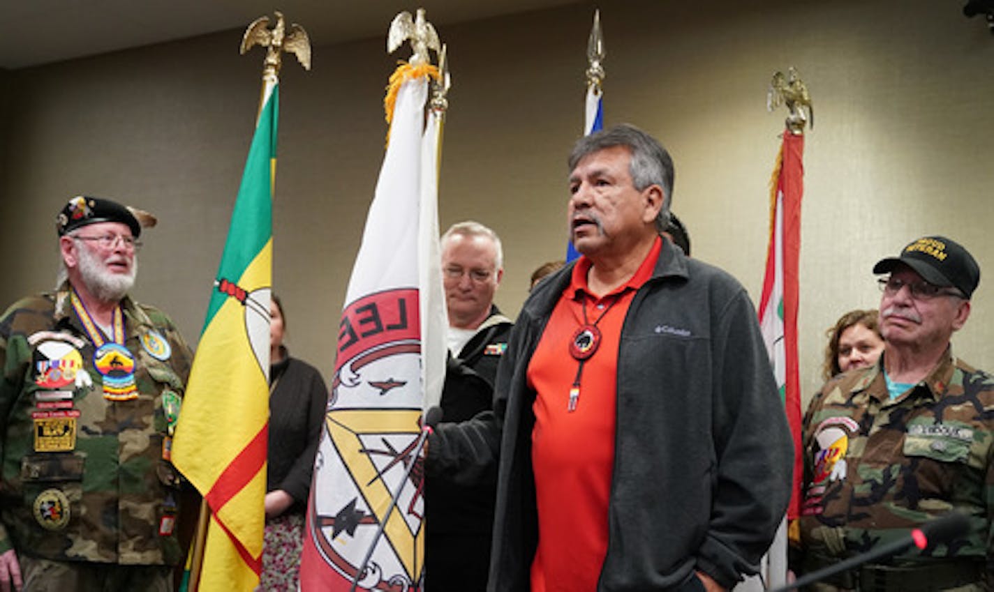 FILE - Leech Lake Tribal Chair Faron Jackson, Sr. presenting the tribal flag at the Juvenile Justice Center last month. Jackson testified before lawmakers over the summer to push them to return nearly 12,000 acres to the tribe, part of a measure now moving through Congress.