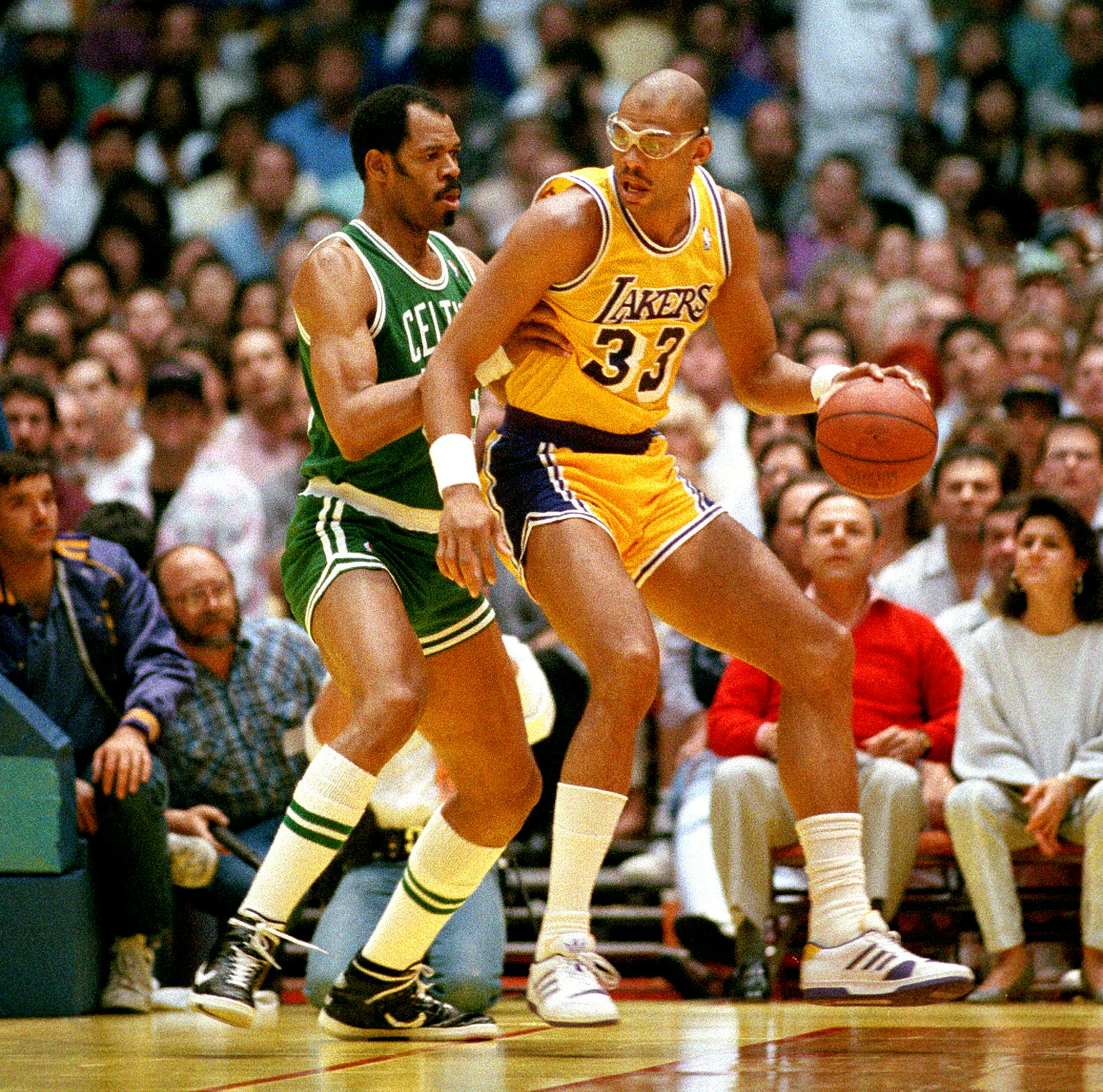 Artis Gilmore, left, of the Boston Celtics, tries to block Kareem Abdul-Jabbar of the Los Angeles Lakers during NBA game at the Forum in Inglewood, Ca., Feb. 14, 1988. The Lakers won 115-106. (AP Photo/Ira Mark Gostin) ORG XMIT: APHS101