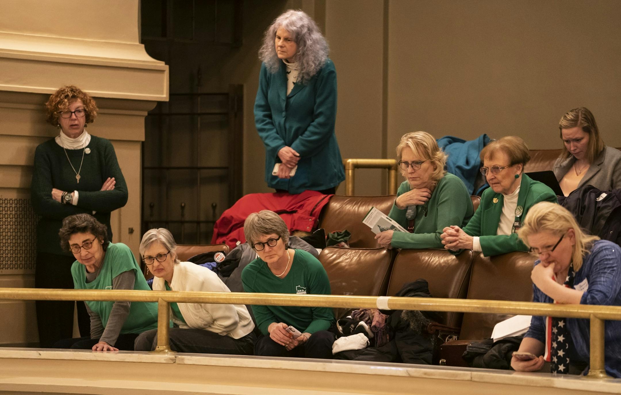 Several women in the gallery at the House of Representatives wore green in support of the Equal Rights Amendment during the house debate and vote of the bill at the State Capitol in St. Paul, Minn., on Thursday, March 7, 2019.