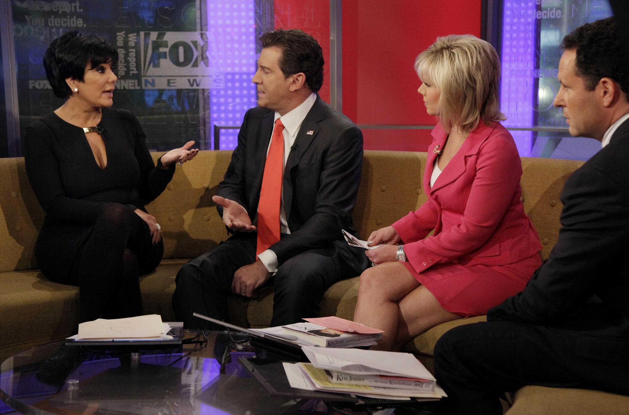 Kris Jenner, left, mother of TV personality Kim Kardashian, is interviewed by co-hosts, from second left, Eric Bolling, Gretchen Carlson and Brian Kilmeade on the "Fox & friends" television program in New York Thursday, Nov. 3, 2011.