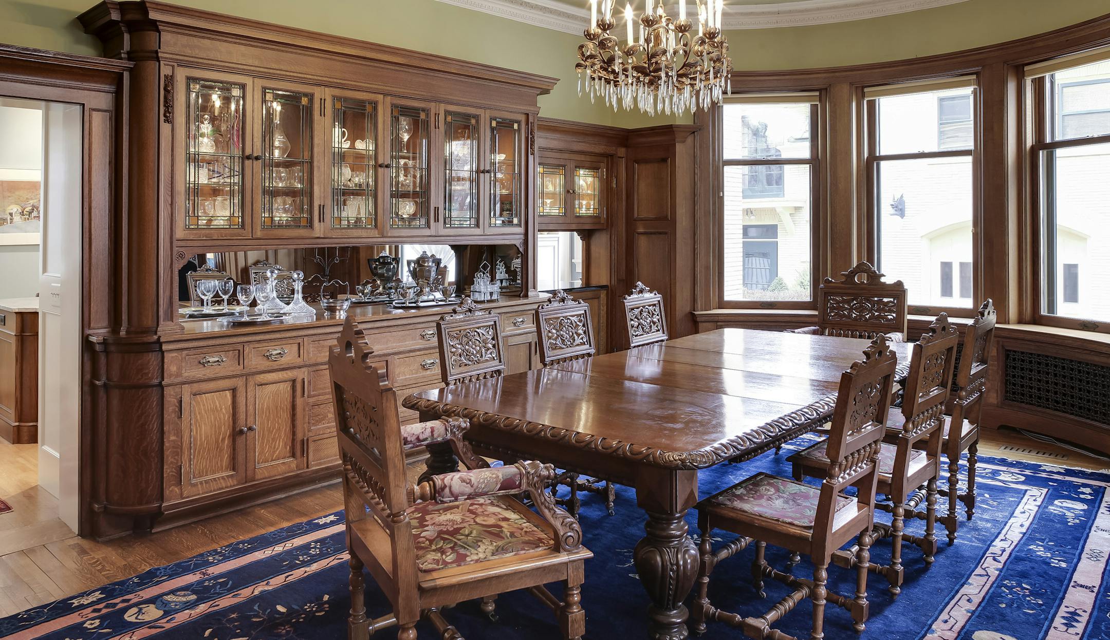 The dining room's oak buffet has leaded-glass doors and is original to the house.