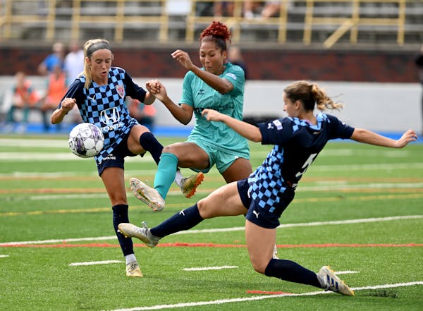 Aurora defender Tianna Harris disrupted play between a pair of Indy Eleven attackers Saturday in the USL W quarterfinals 
