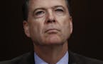 In this Wednesday, May 3, 2017, photo, then-FBI Director James Comey pauses as he testifies on Capitol Hill in Washington, before a Senate Judiciary C