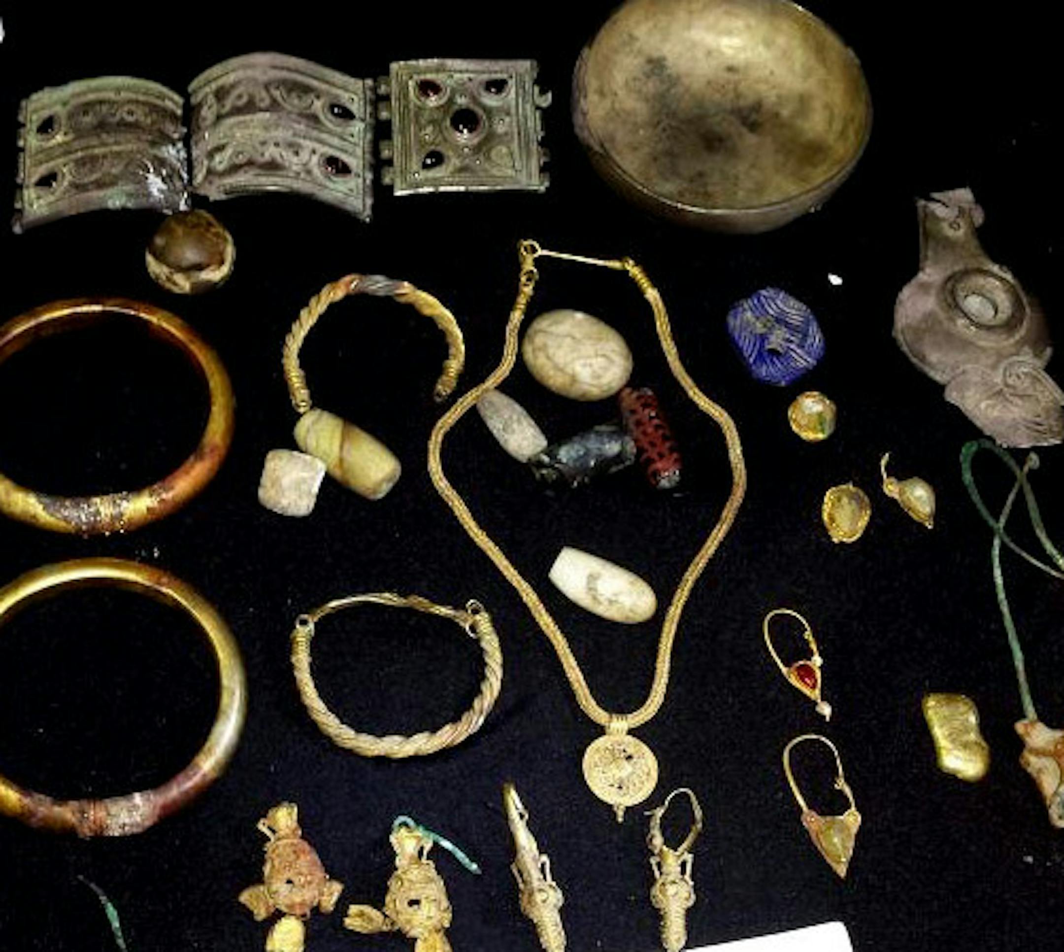 This July 6, 2015 photo provided by The Day After Heritage Initiative, shows jewelry looted from archeological sites in Deir el-Zour and displayed for sale by the Islamic State group in Syria. Faced with the Islamic State group onslaught, Syrian antiquities authorities succeeded in evacuating hundreds of thousands of artifacts to safety from museums around the country in recent years, but they could not rescue everything and IS militants have been destroying and looting sites to sell relics. (Th