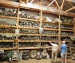 Bill Gombold, left, looked over his decoy collection in his pole barn.