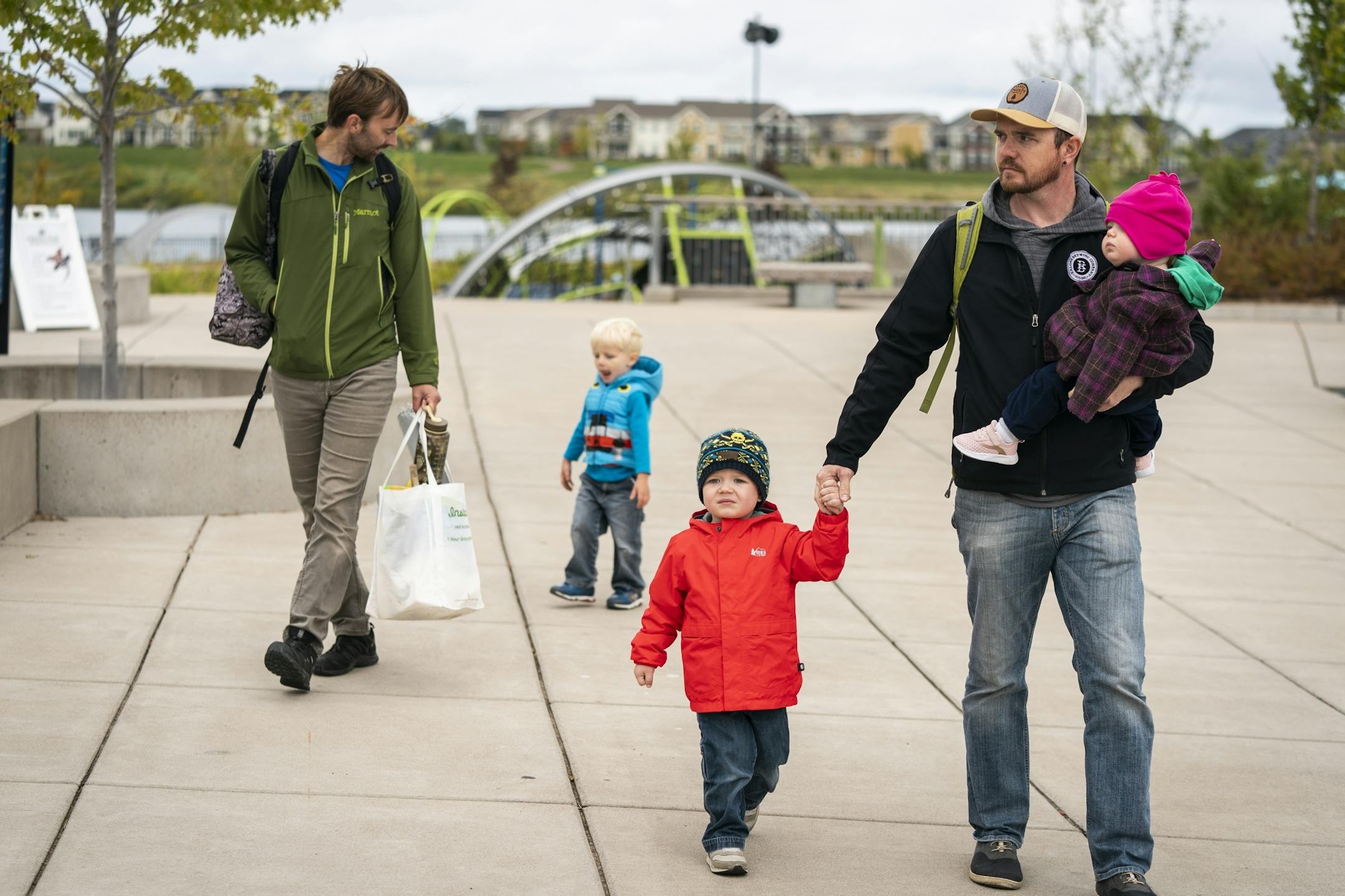 Nic Sabatke, right, with his son Anders, 3, and daughter Mae, 1 attends a Twin Cities Dads playgroup at Central Park in Maple Grove with Keith Nagel and his son Sawyer, 3.