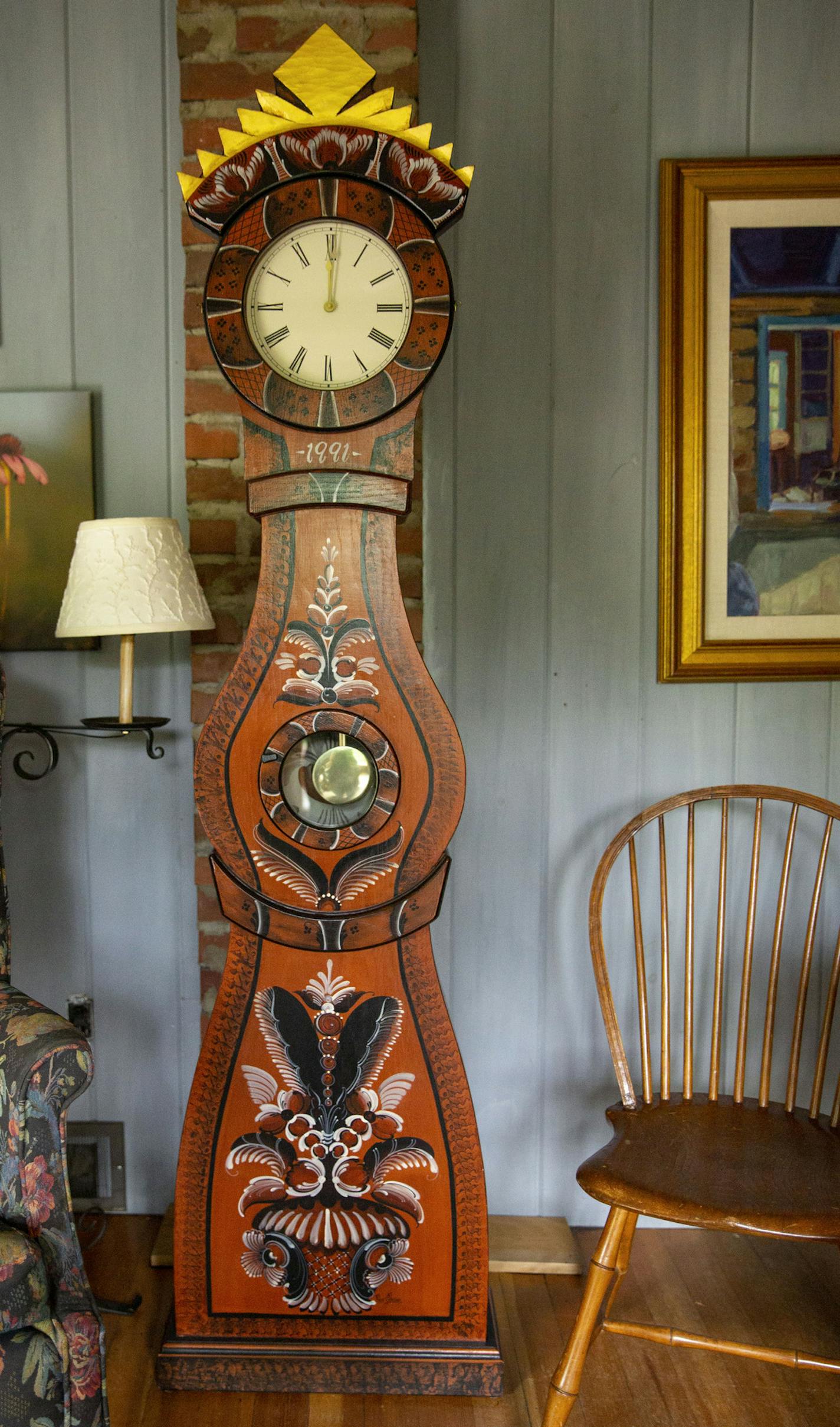 A large rosemaled clock sits in the center of a sitting room. ALEX KORMANN &#xa5; alex.kormann@startribune.com Karen Jenson is an 82-year-old artist who spent most of her life mastering the Norwegian and Swedish painting styles of rosemaling and dalamaling, respectively. She no longer lives in the home and is in the process of transforming it into a museum or artist's residence.