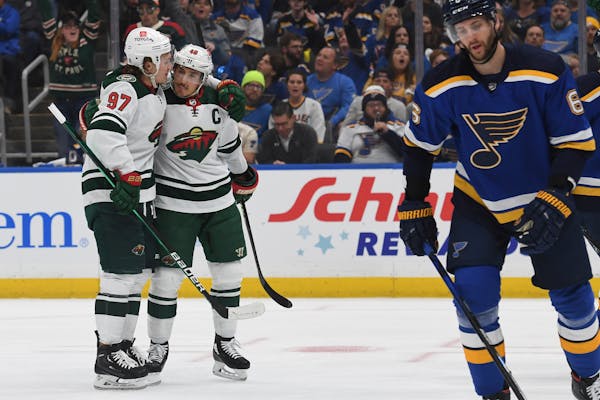 Minnesota Wild's Kirill Kaprizov (97) and Jared Spurgeon (46) celebrate after scoring a goal during the first period in Game 4 of an NHL hockey Stanle