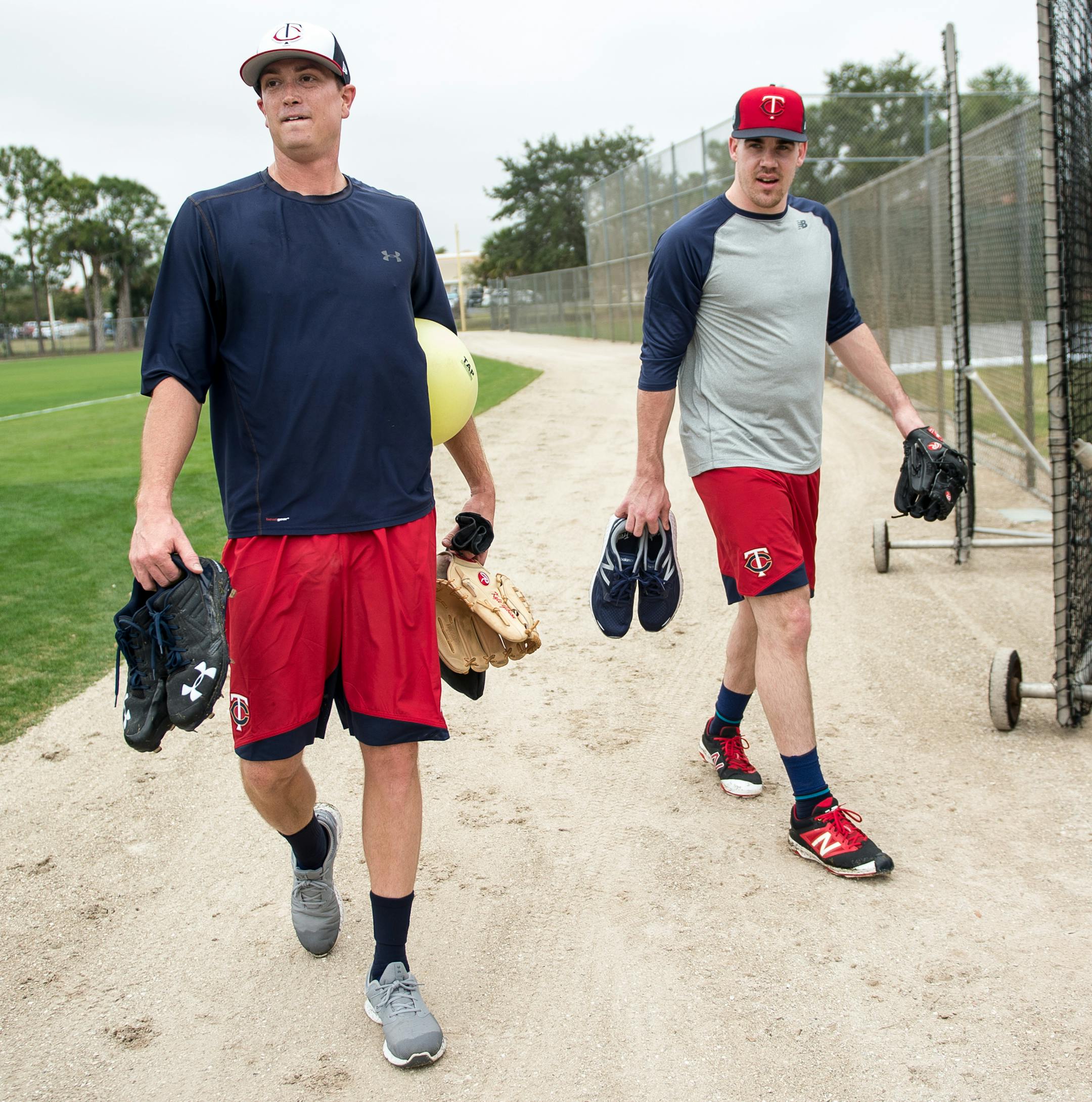 Kyle Gibson, left, and Trevor May walked back to the clubhouse after finishing practice Tuesday morning at CenturyLink Sports Complex. ] AARON LAVINSKY &#xef; aaron.lavinsky@startribune.com Minnesota Twins players took part in Spring Training on Tuesday, Feb. 14, 2017 at CenturyLink Sports Complex in Fort Myers, Fla.