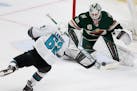 Minnesota Wild's goalie Cam Talbot (33) stops the puck shot by San Jose's Kevin Labanc (62) during the third period of an NHL hockey game Friday, Apri