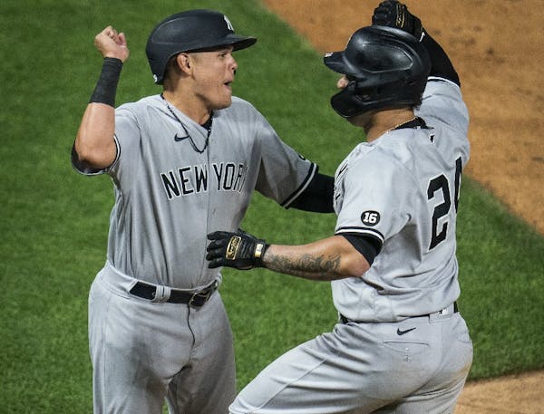 Gary Sanchez (right) and Gio Urshela celebrated at home play after Sanchez hit a home run against the Twins at target Field last season.