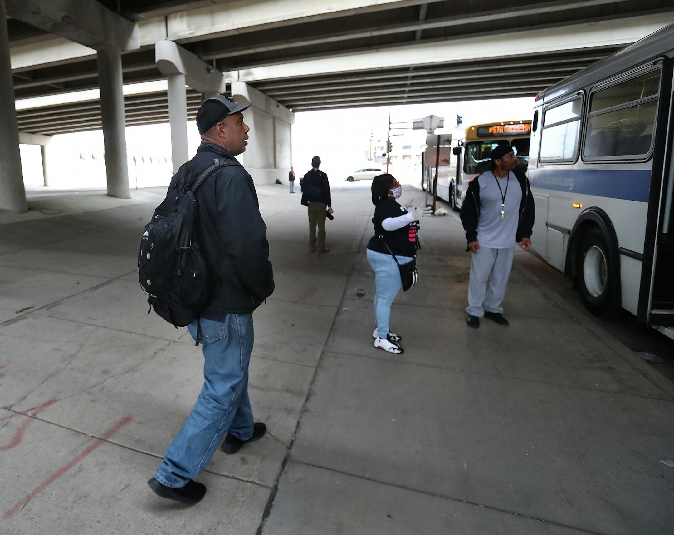 After moving out of the Higher Ground homeless shelter in Minneapolis Douglas Pyle, 49, prepares to board a city bus that will take him to his hotel room for the first time Friday, May 1, 2020, in Minneapolis, MN. Pyle, whose life's possessions fit into his backpack, is among more than 400 homeless people in Hennepin County who have been relocated to area hotels since the pandemic began. Pyle grew up in Indiana, spent a number of years in Florida and Madison, WI, before coming to Minneapolis 13