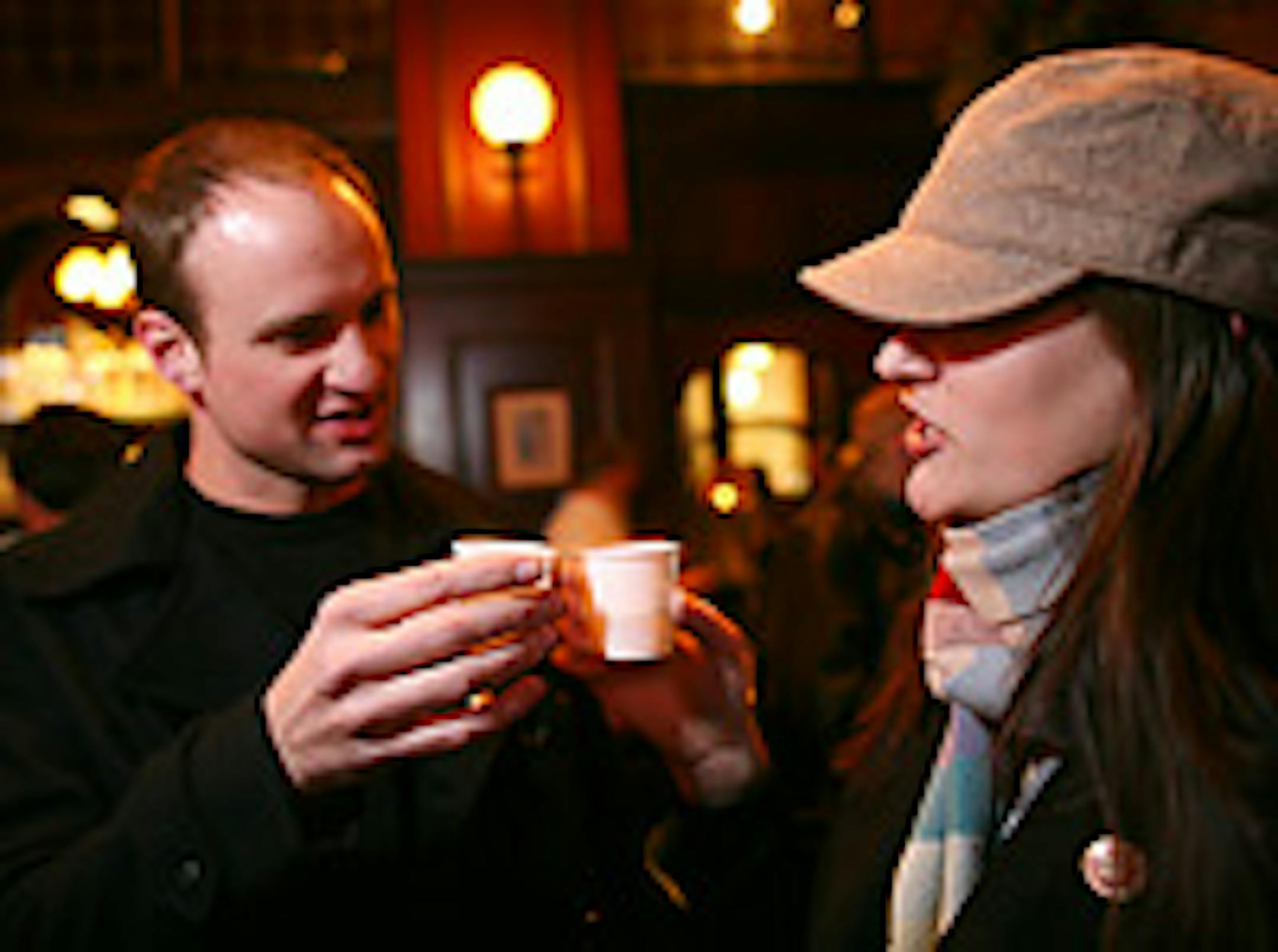 The Drinking Squad's Joe Holan, left, and Moe Regnier prepare to taste the first cocktail of the night, the Big Ginger at the Local in Minneapolis.