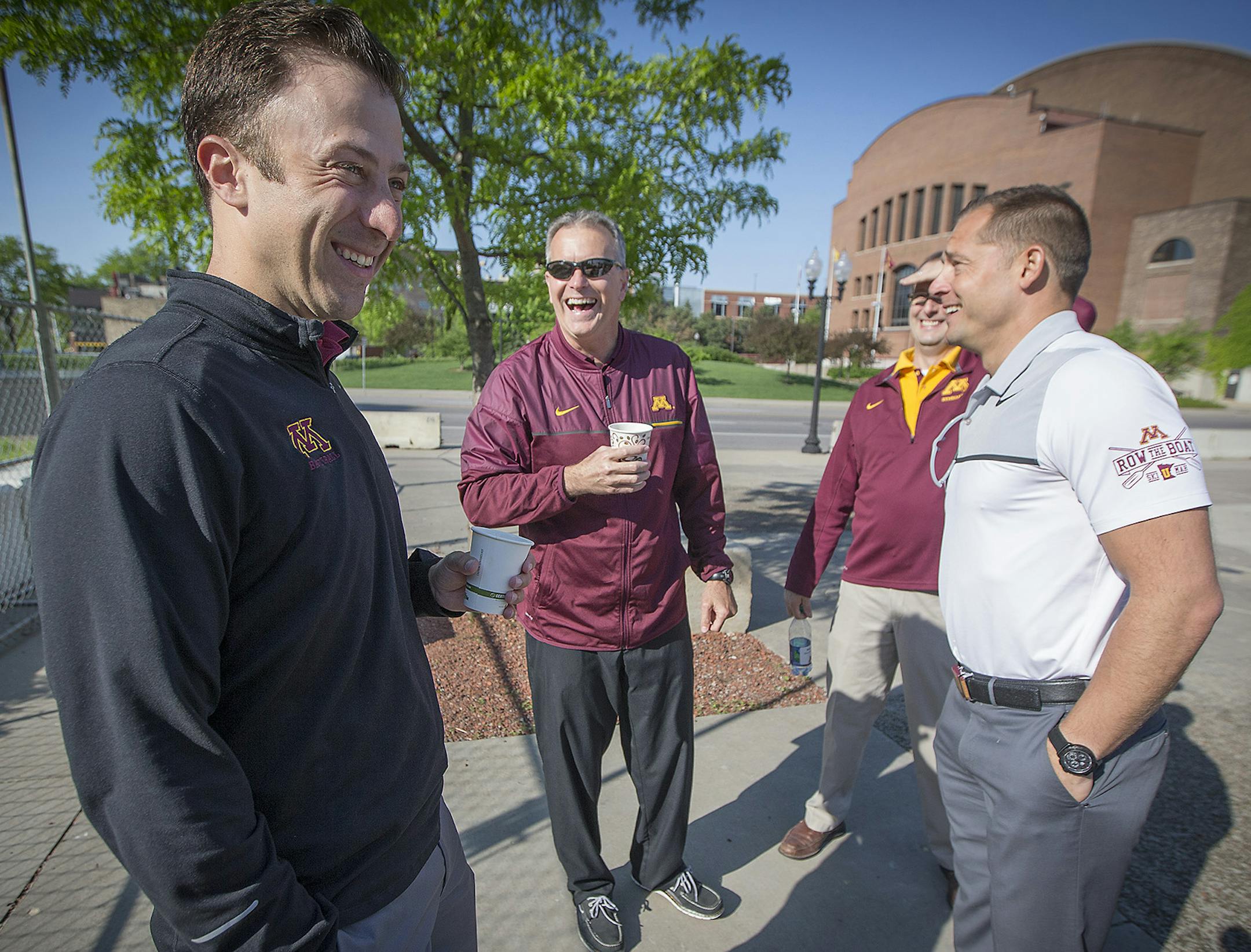 University of Minnesota coaches including from left, men's basketball coach Richard Pitino, men's hockey coach Don Lucia, and football coach PJ Fleck, huddled for laughs before they loaded a bus as they launched their summer caravan with a kickoff party outside TCF Bank Stadium, Monday, May 22, 2017 in Minneapolis, MN. ] ELIZABETH FLORES &#xef; liz.flores@startribune.com