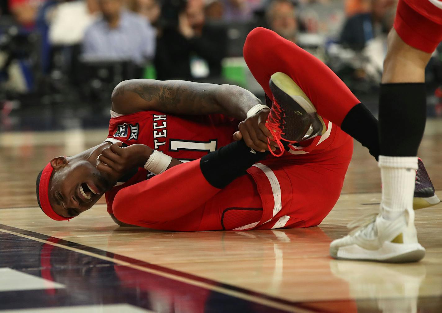 Texas Tech's Tariq Owens injured his ankle during the second half in the semifinals