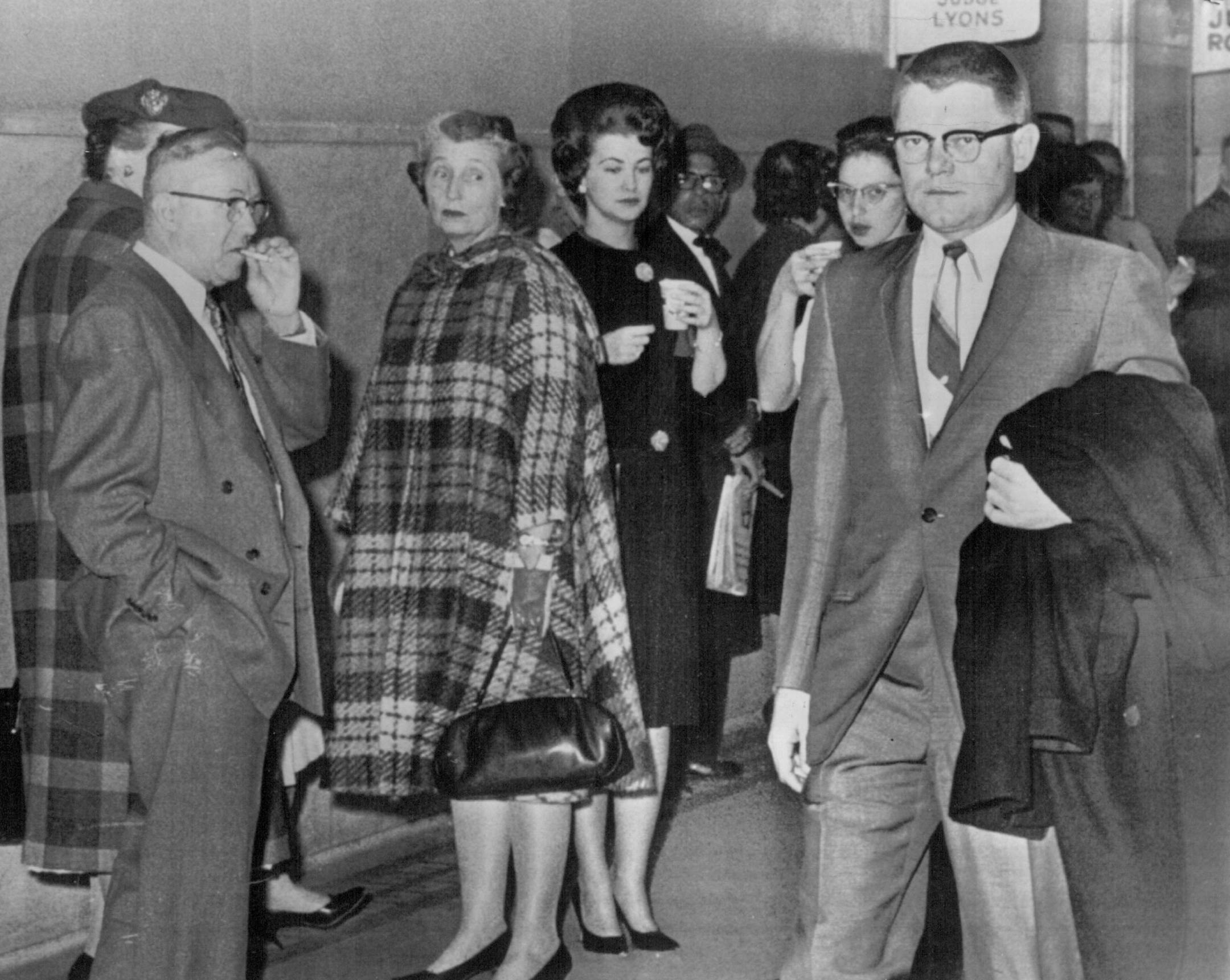 November 7, 1963 All eyes were on T.Eugene Thompson (right) as he walked in corridor outside courtroom. Spectators watched a crew-cut T. Eugene Thompson walk to the courtroom Nov. 6, 1963, during his much-talked-about trial. He was convicted of ordering the murder of his wife, Carol, above. On December 7, photo at right, Thompson waited in the Stillwater Prison reception room to begin his sentence. He continued to protest his innocence. December 16, 1982 November 6, 1963 July 1, 1974 Associated