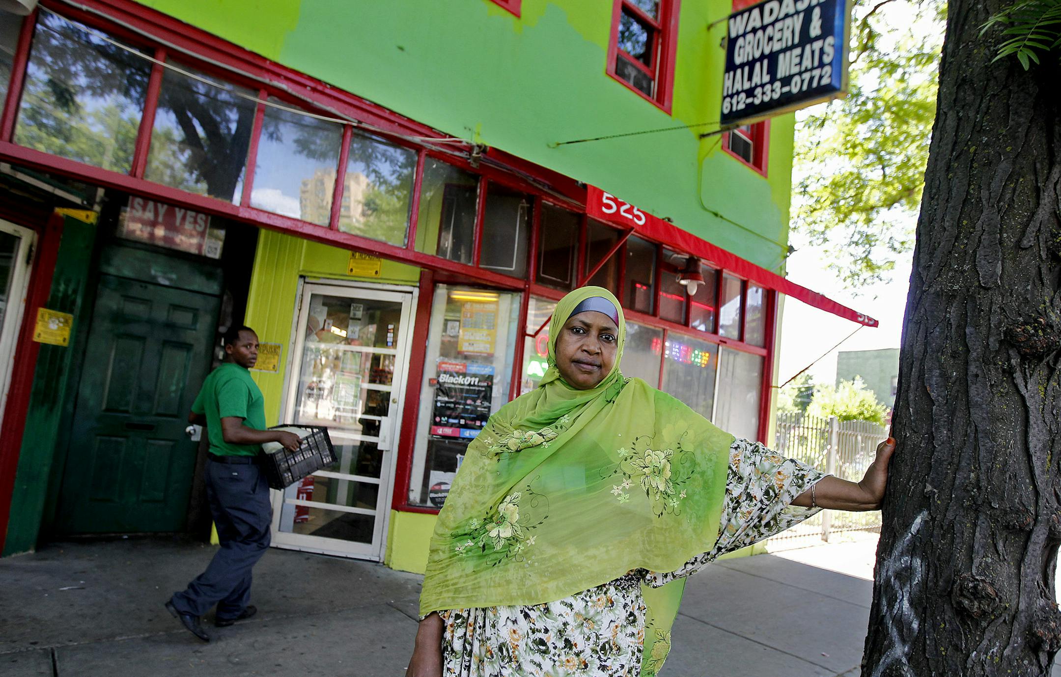 Kamaro Ali, who owns Wadajir Grocery at 525 Cedar, stood in front of an area that will soon change, Thursday, June 27, 2013. Hennepin County has big plans for the historic Cedar-Riverside area. The county intends to tear up and narrow the road to two lanes to make way for expanding the sidewalks. The passage is the most highly traversed pedestrian area in Minneapolis and in 2014, it becomes even more of a crossroads with the opening of the new light-rail line between the Twin Cities. (ELIZABETH