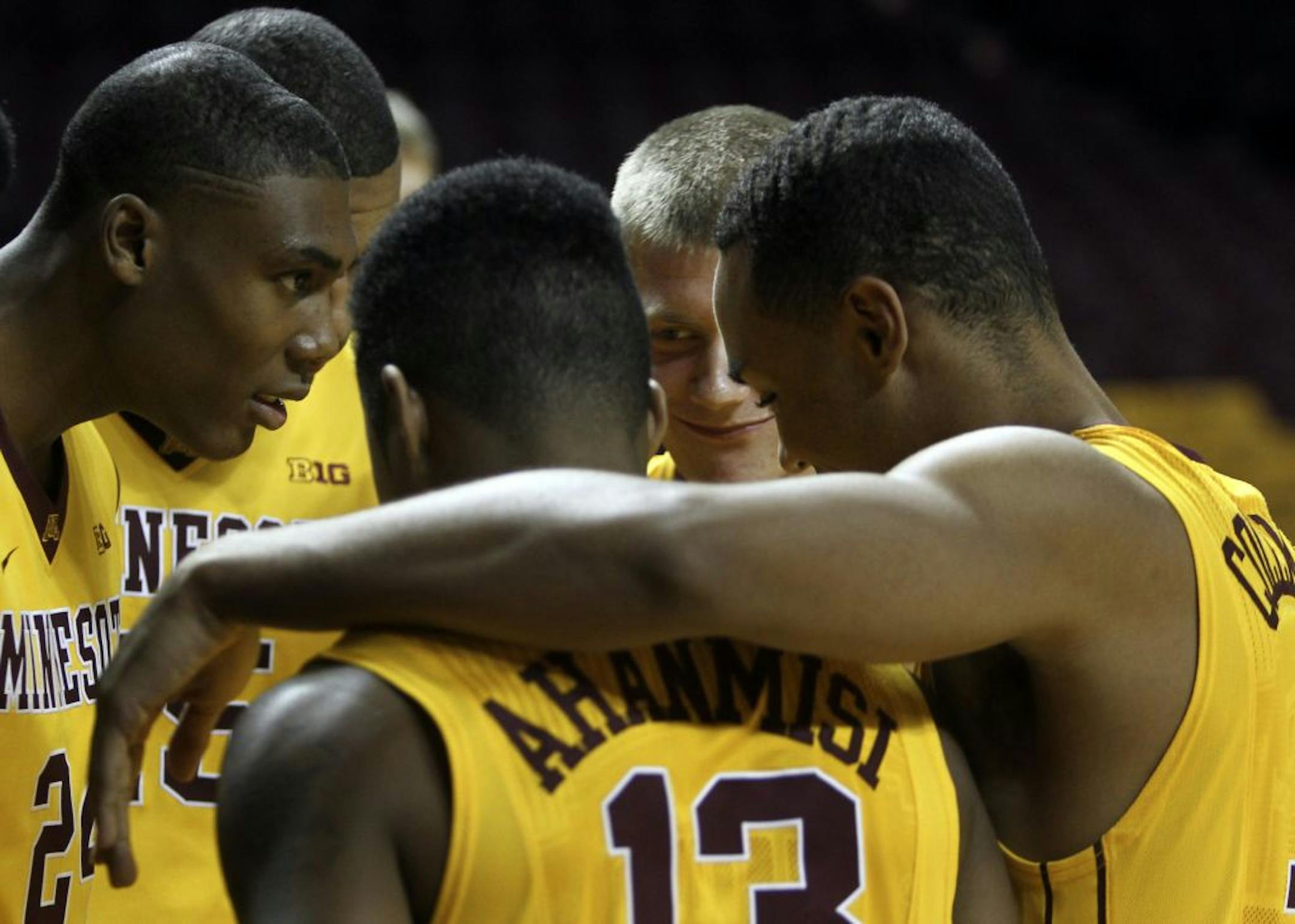The Gophers Joe Coleman, right, gathered around teammates near the end of the University of Minnesota men's basketball team media day Friday, Oct. 12, 2012, at Williams Arena at the University of Minnesota.