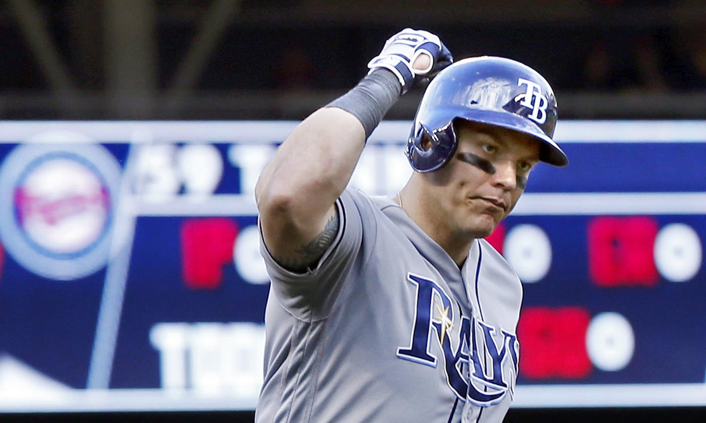 Tampa Bay Rays' Logan Morrison celebrates his three-run home run off Minnesota Twins pitcher Michael Tonkin in the seventh inning of a baseball game Saturday, June 4, 2016, in Minneapolis. (AP Photo/Jim Mone) ORG XMIT: MIN2016060516361159