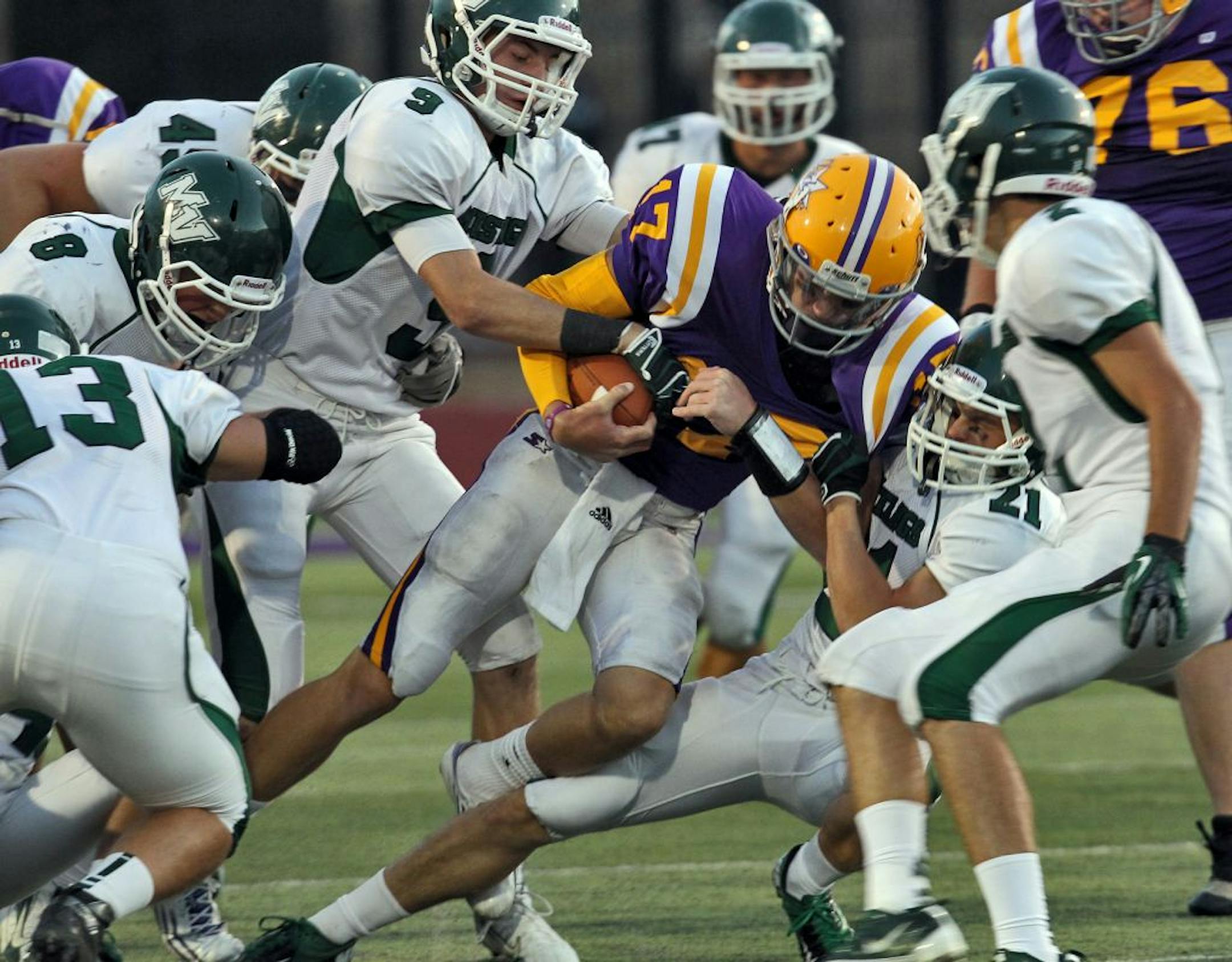 Mounds View defenders swarmed Cretin-Derham Hall quarterback Conor Rhoda when the teams met in September. The Mustangs, 8-1, host Eastview on Friday night. Photo: MARLIN LEVISON/STARTRIBUNE, mlevison@startribune.com