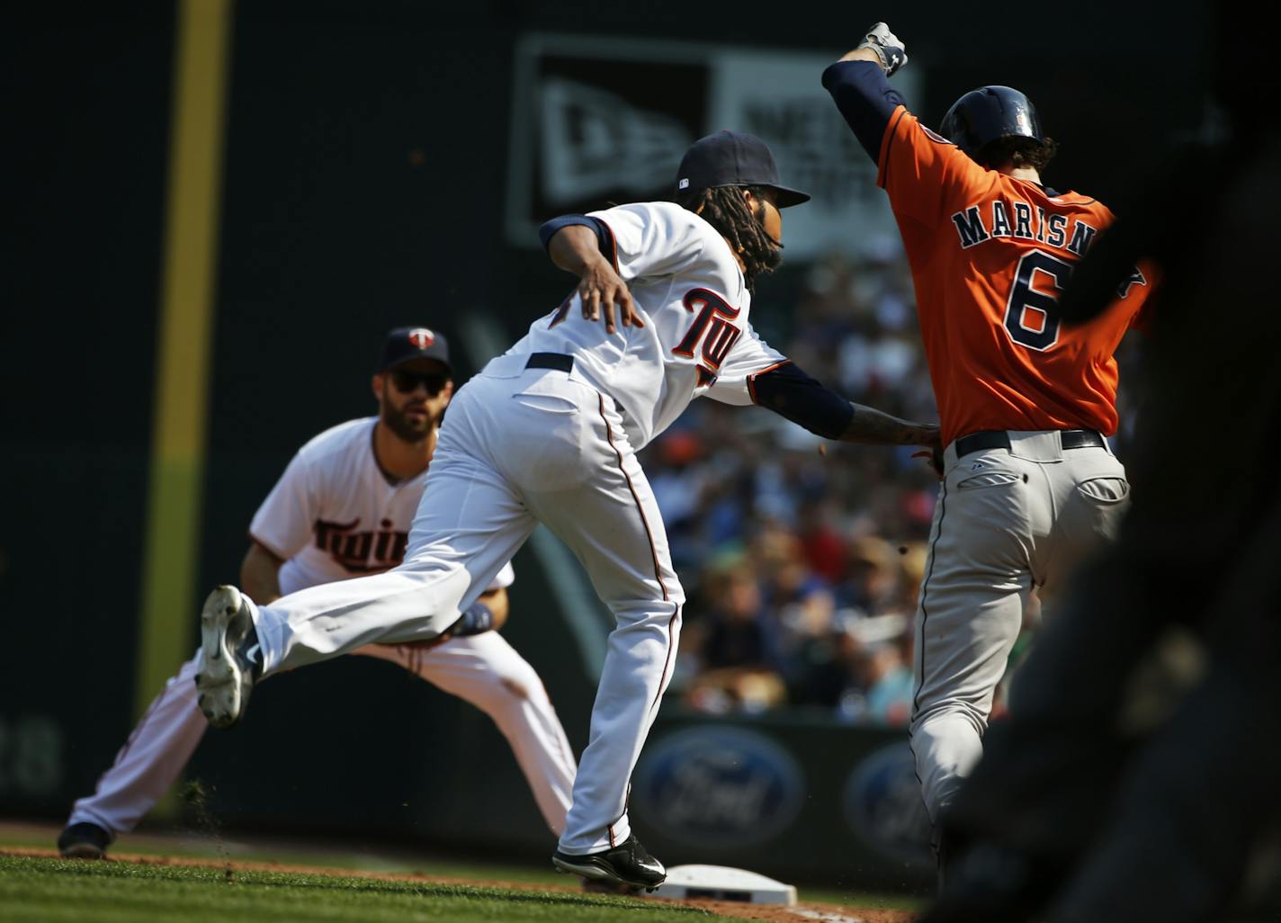 In the sixth inning, Jake Marisnick(6) grounds out on a bunt to pitcher Ervin Santana(25).