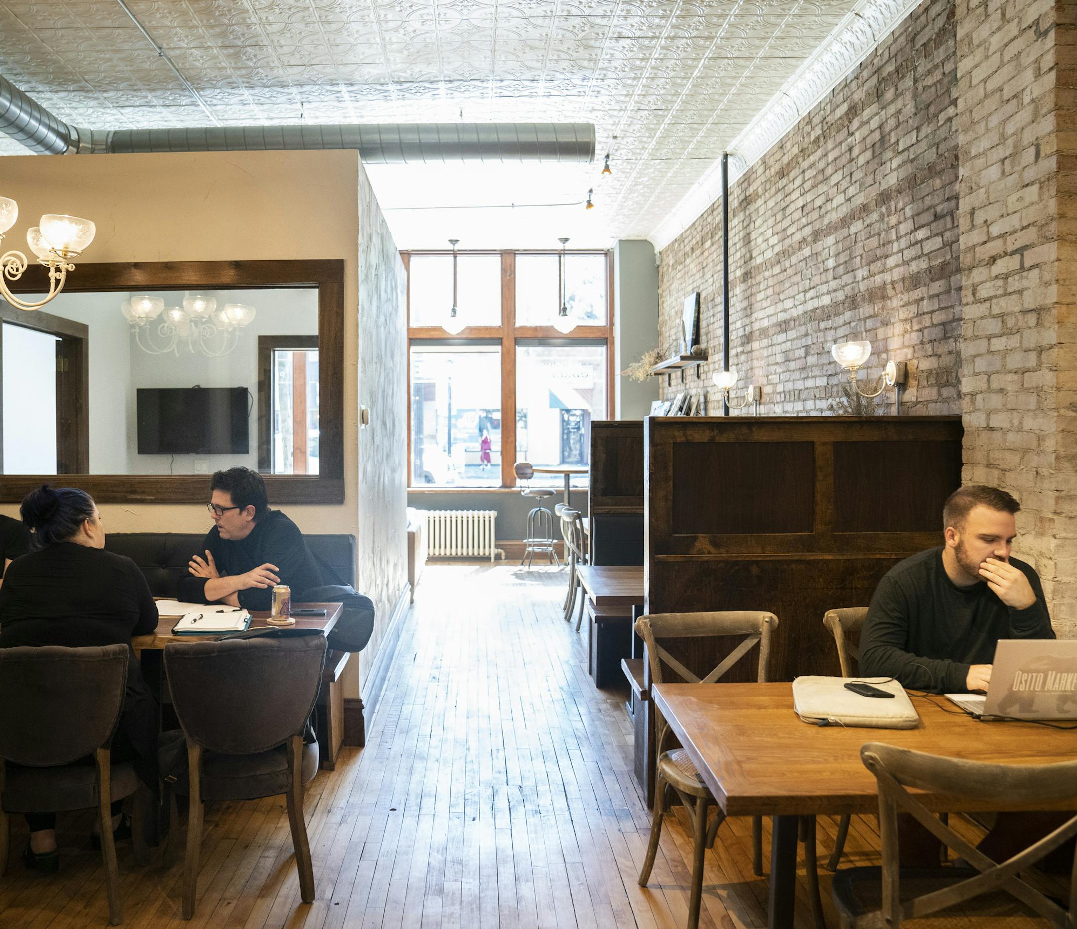Several wedding vendors worked and chatted at Jody Winter's "co-working' space for wedding vendors called Cornerstone in Minneapolis, Minn., on Tuesday, June 25, 2019. ] RENEE JONES SCHNEIDER ¥ renee.jones@startribune.com