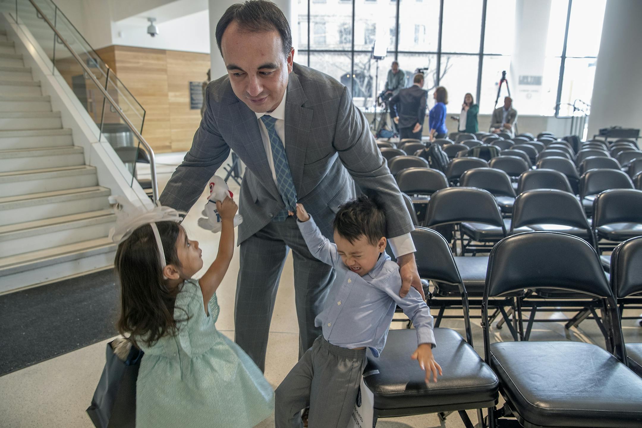Minnesota Timberwolves new President of basketball operations Gersson Rosas was greeted by his tired 3-year-old twins Giana, left, and Grayson after he gave an interview at the Target Center, Monday, May 6, 2019.