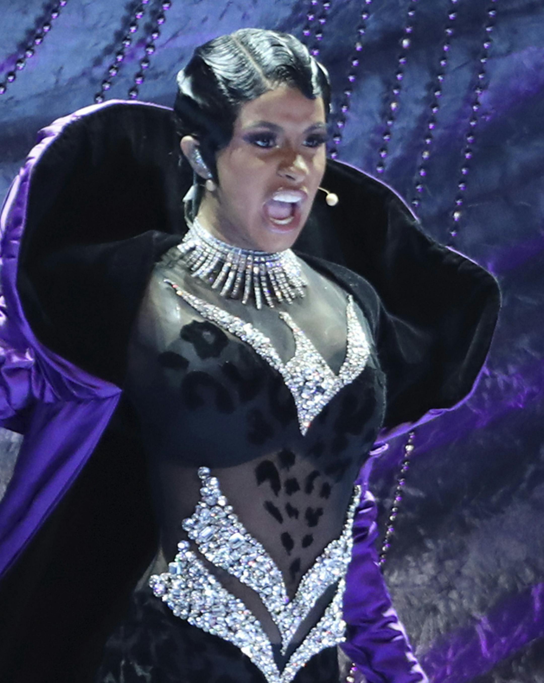 FILE - In this Sunday, Feb. 10, 2019, file photo, Cardi B performs "Money" at the 61st annual Grammy Awards in Los Angeles. Rapper Cardi B is among the acts scheduled to perform at the Beale Street Music Festival set for May 3 through May 5 in Memphis, Tenn. (Photo by Matt Sayles/Invision/AP, File)