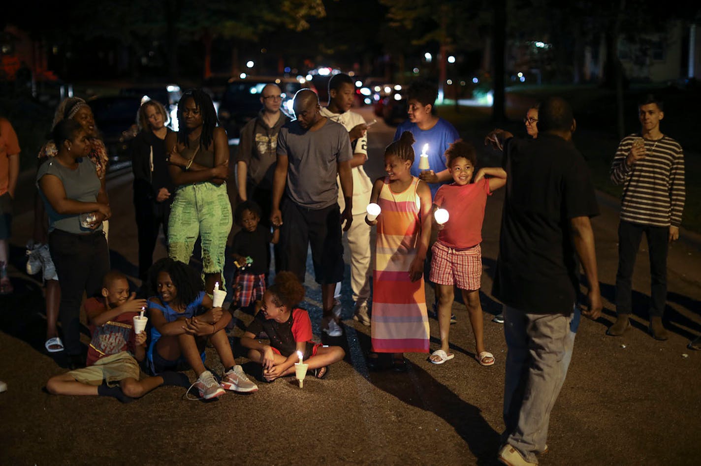 A vigil organizer went around the intersection and had everyone remaining at the vigil speak Thurman Blevins' name. A group of children on the pavement of Camden Ave. N. were included, too.