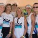 Jenny Merthan, K.G. Green, Kaitlin McCloughan, Ginny Lalley, Kirsten Leaf and Wendy Sanchez of the Over the Edge team prepare to race their Dragon Boa