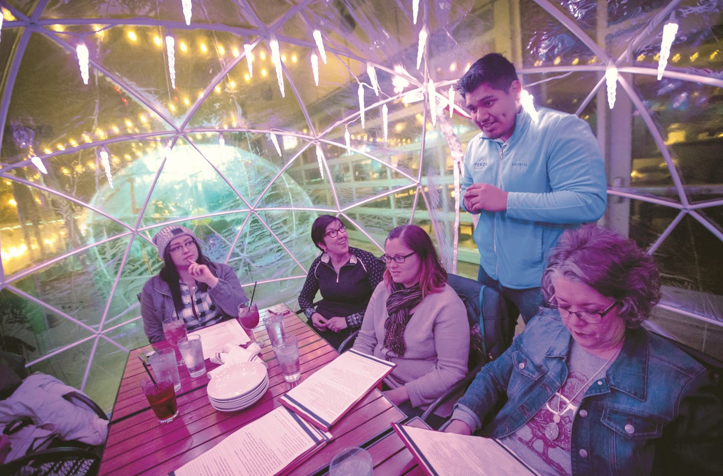 Server Peter Tazin took an order from Mayo colleagues, from the left, Hannah Wright, Jean Fox, Stacy Weelborg and Ruth Grimm in an igloo on the rooftop at La Vetta on Wednesday, January 10, 2018, in Rochester, Minn. ] RENEE JONES SCHNEIDER &#x2022; renee.jones@startribune.com