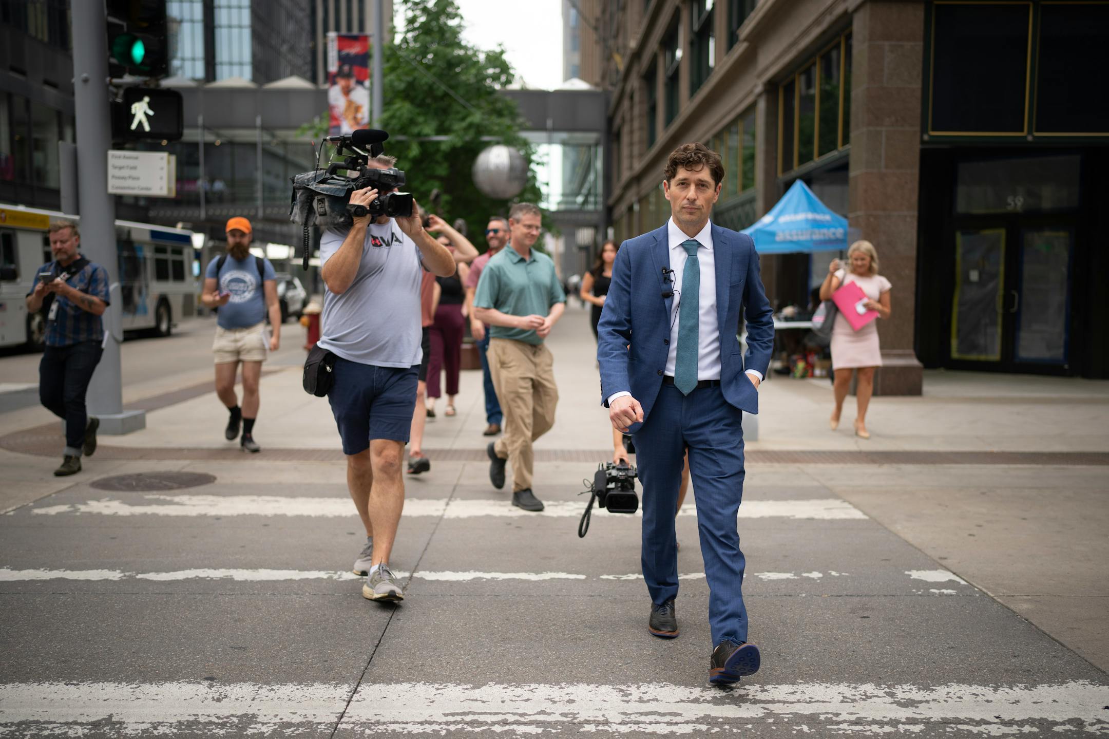 Minneapolis Mayor Jacob Frey led local media on a walking tour of a stretch of the Nicollet Mall that could see changes such becoming pedestrian-only. Before that he was joined at a news conference Tuesday, June 6, 2023 at Dayton's by members of his newly formed "Vibrant Downtown Storefronts Workgroup" to announce recommendations the group submitted to him.