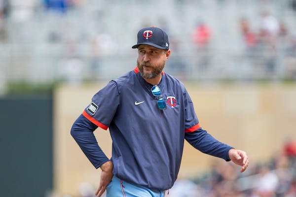 Minnesota Twins Rocco Baldelli talks with umpires against the Detroit Tigers during a baseball game, Saturday, July 10, 2021, in Minneapolis. (AP Phot