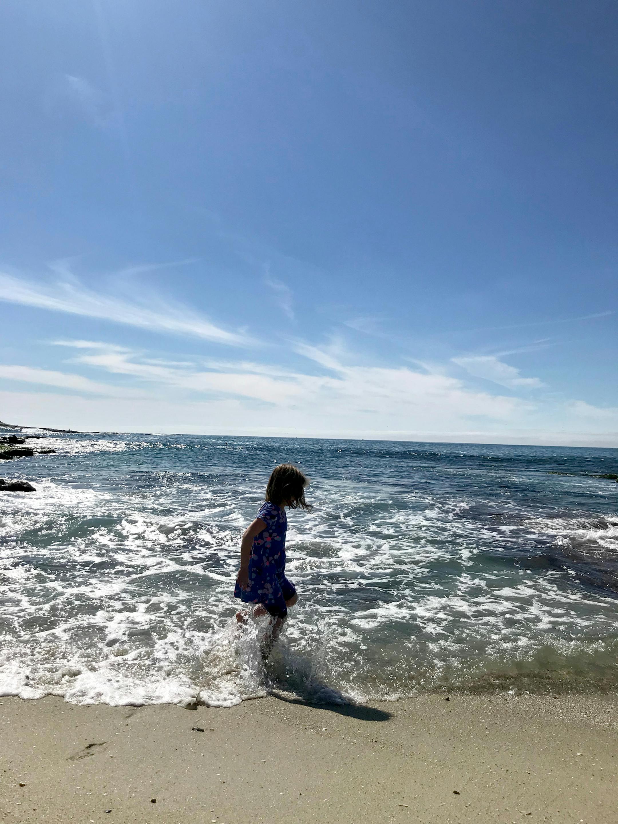The Pacific's gentle waves entertain the author's daughter in La Jolla. Photo by Berit Thorkelson * Special to the Star Tribune