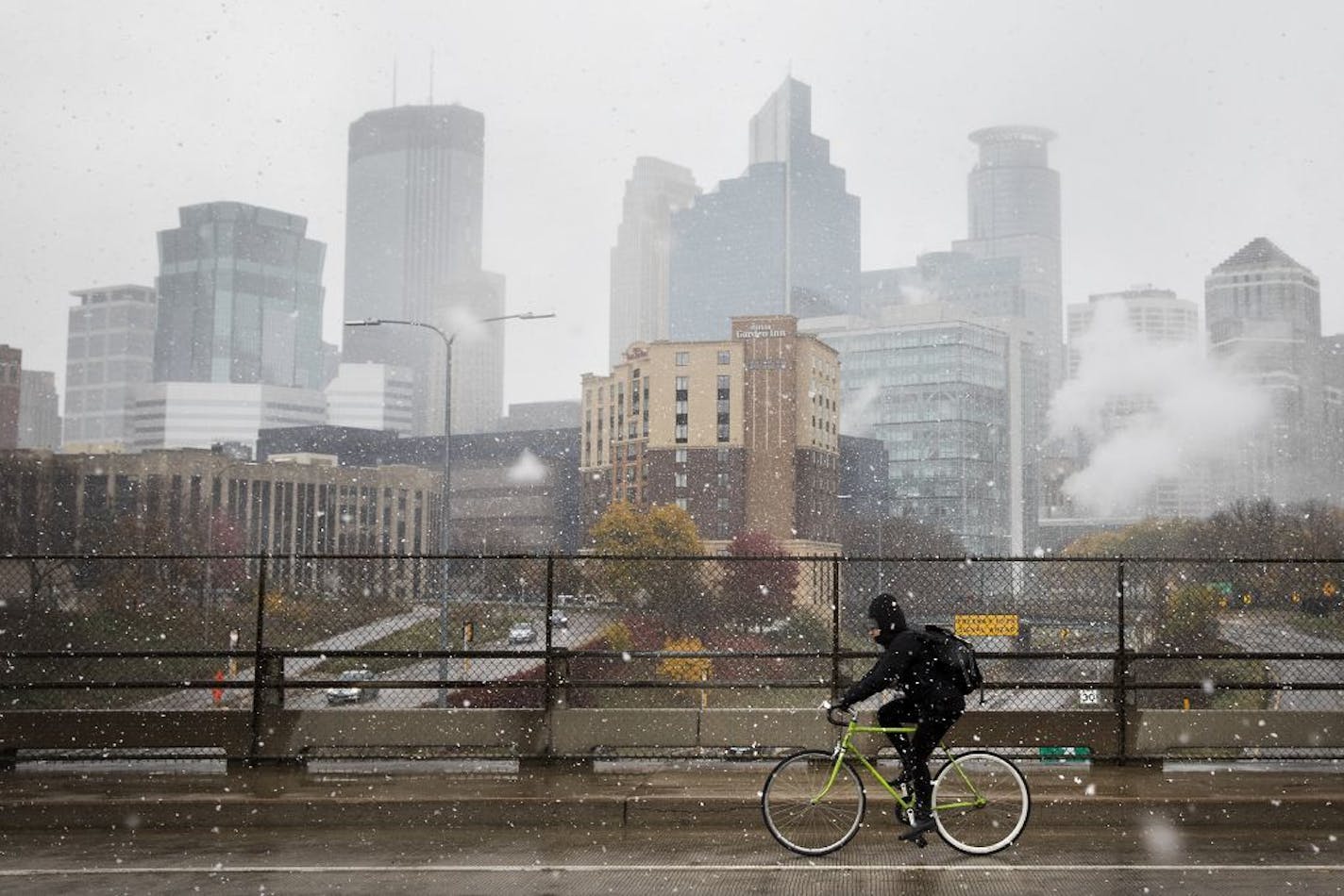 A view of downtown Minneapolis from the 15th Street bridge during the first snow of the season.