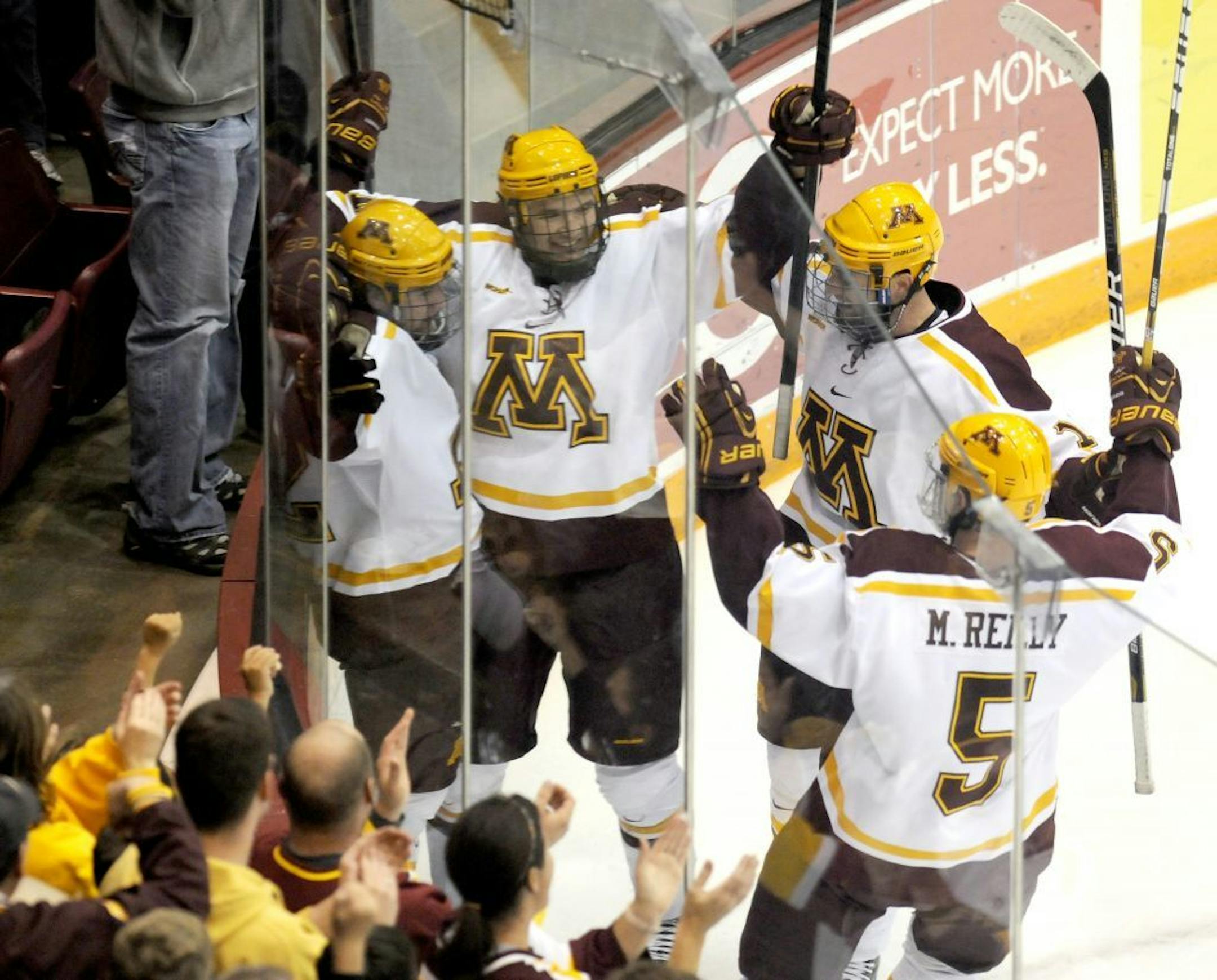 Minnesota players celebrate Travis Boyd's goal in the first period against Minnesota State Mankato's in an NCAA hockey game on Friday, Nov. 2, 2012, in Minneapolis.